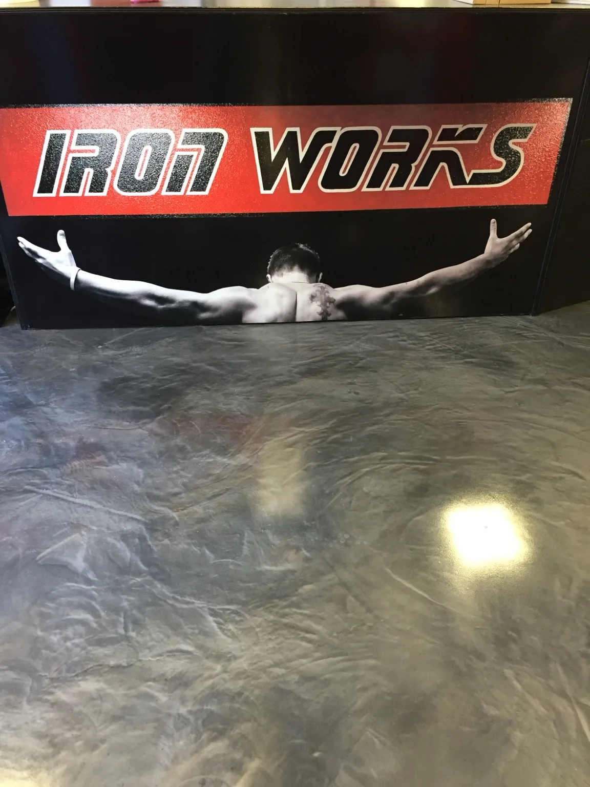 Custom logo embedded in decorative concrete