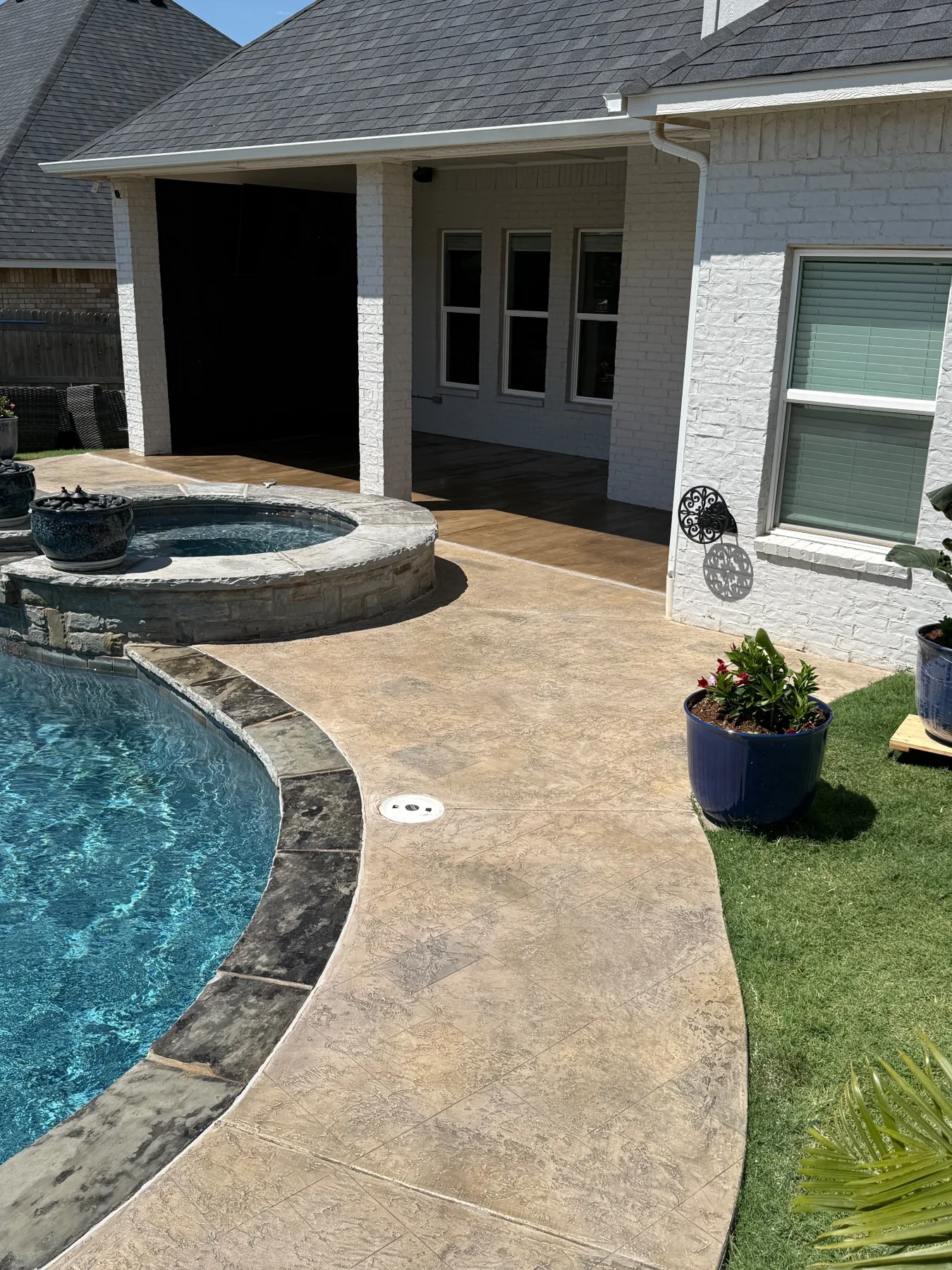 Outdoor decorative concrete and wood-look patio