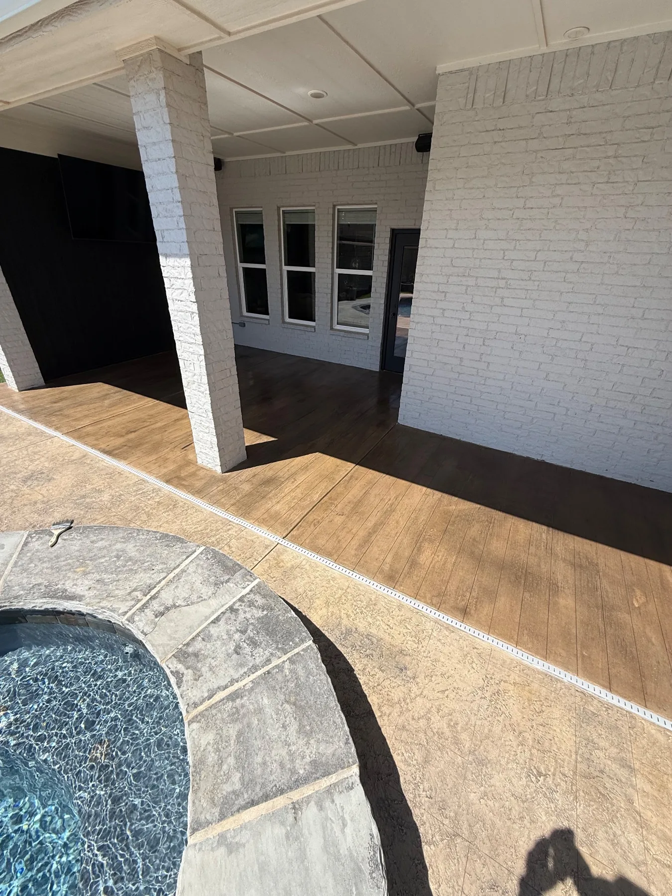 Wood-look patio and decorative pool deck