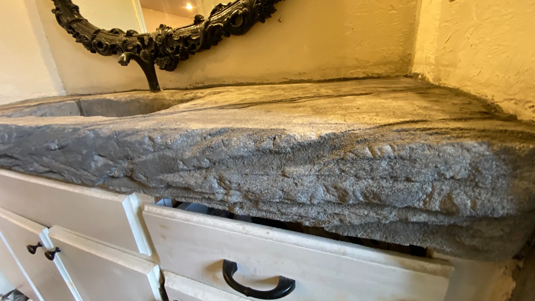 Hand-finished concrete sink edge detail
